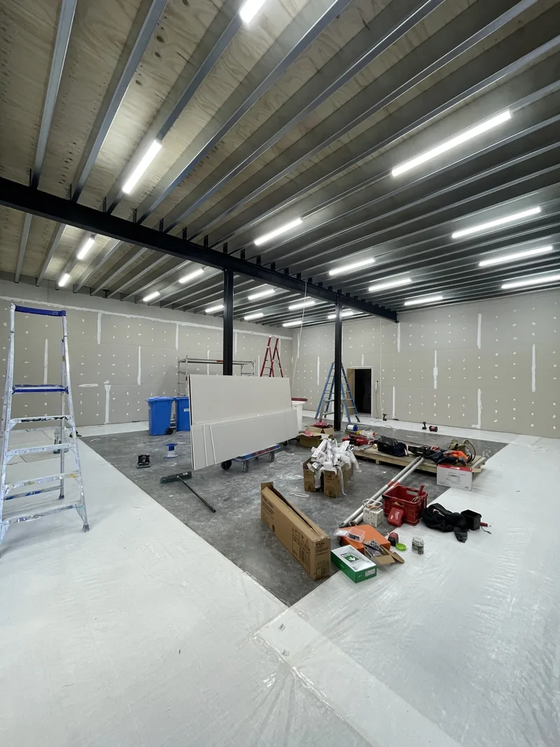 During: LED battens installed the length of the roof while the fit-out continues below