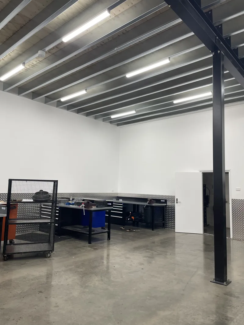 The completed workshop space under the LED batten lighting