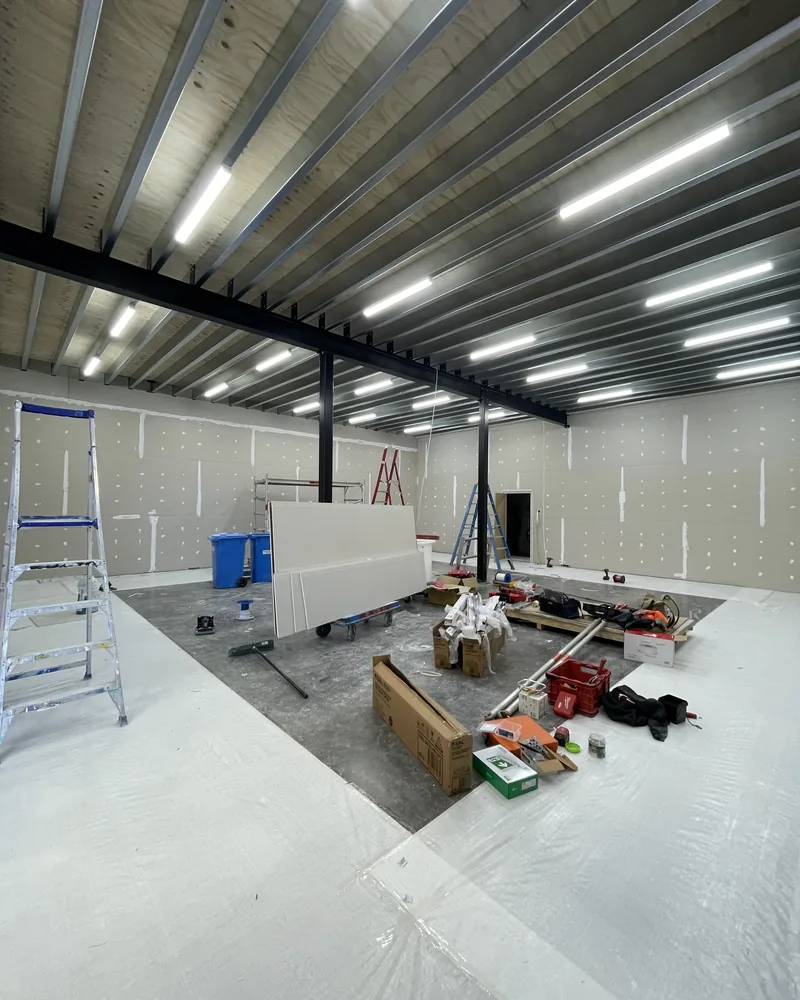 During: LED battens installed the length of the roof while the fit-out continues below