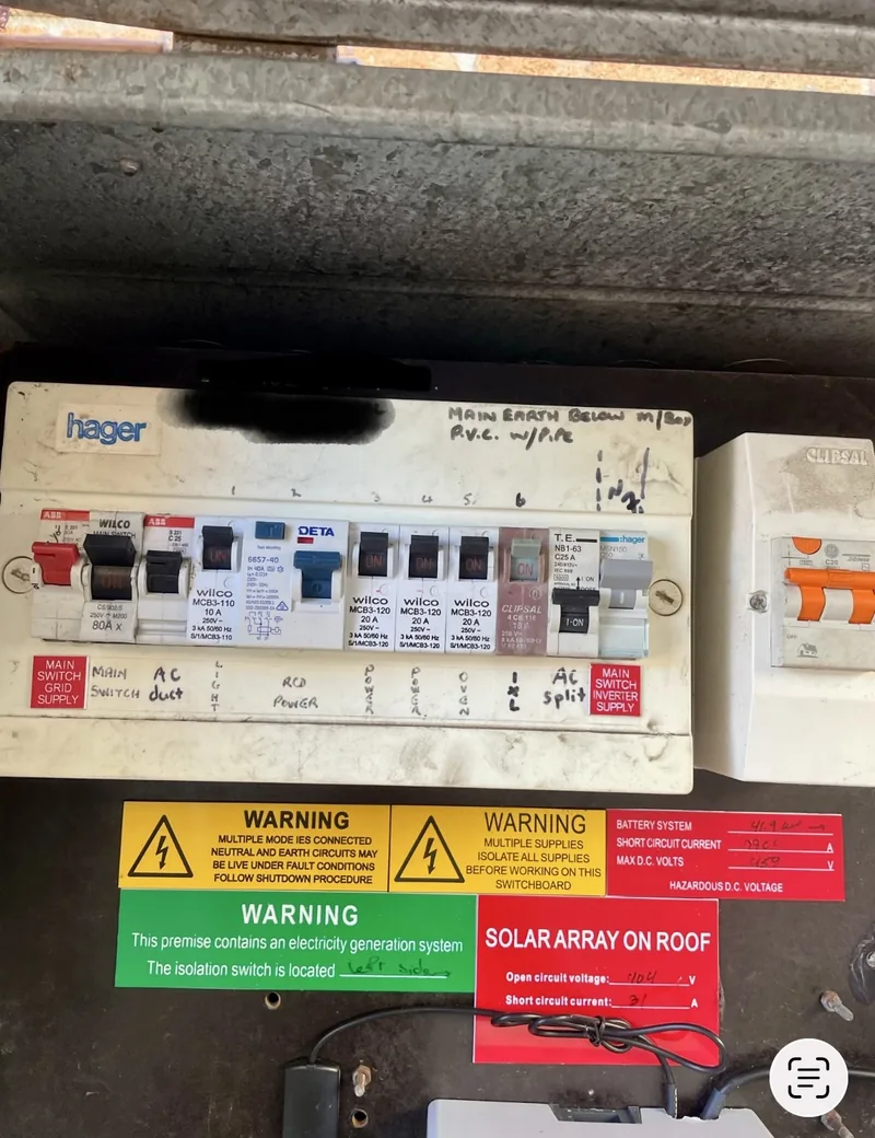 Before: the second board, with hand written labelling and solar warning stickers